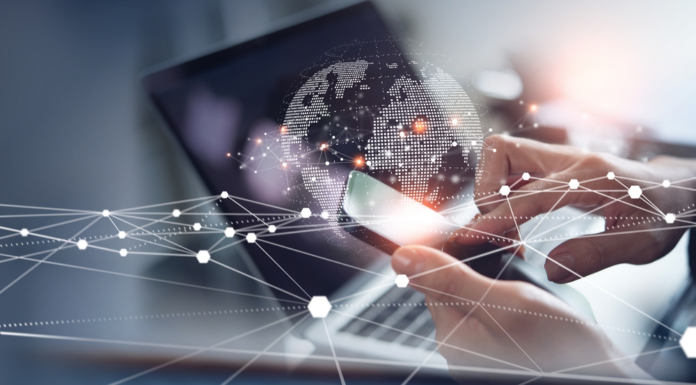 Business communication occurring on a smart phone and a laptop